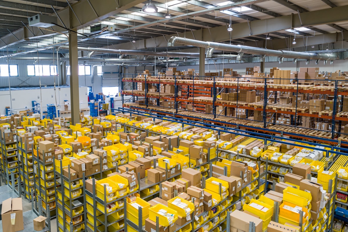 Warehouse aisle with stacked pallets and logistics inventory