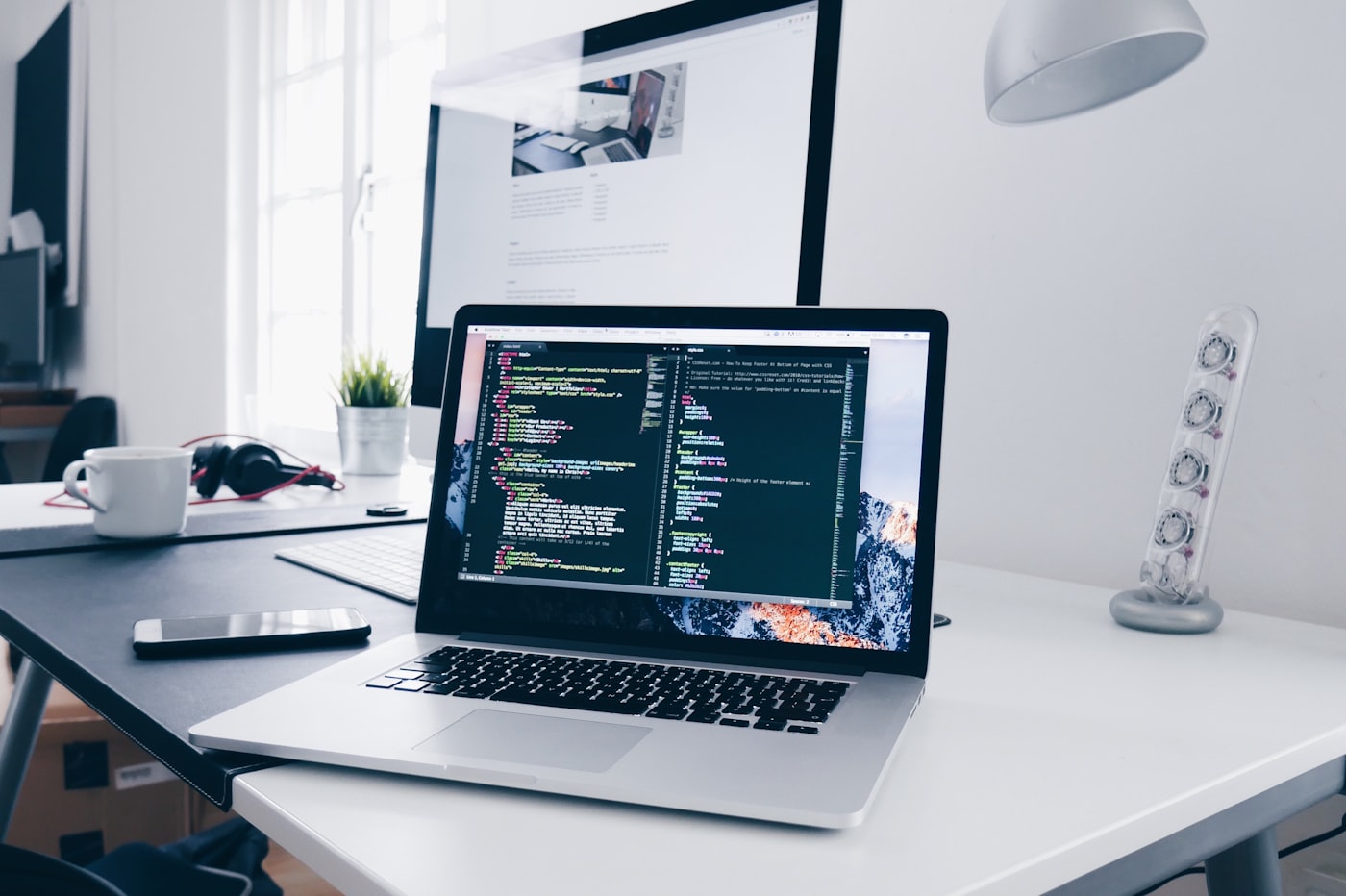 Laptop with custom software code in a development environment